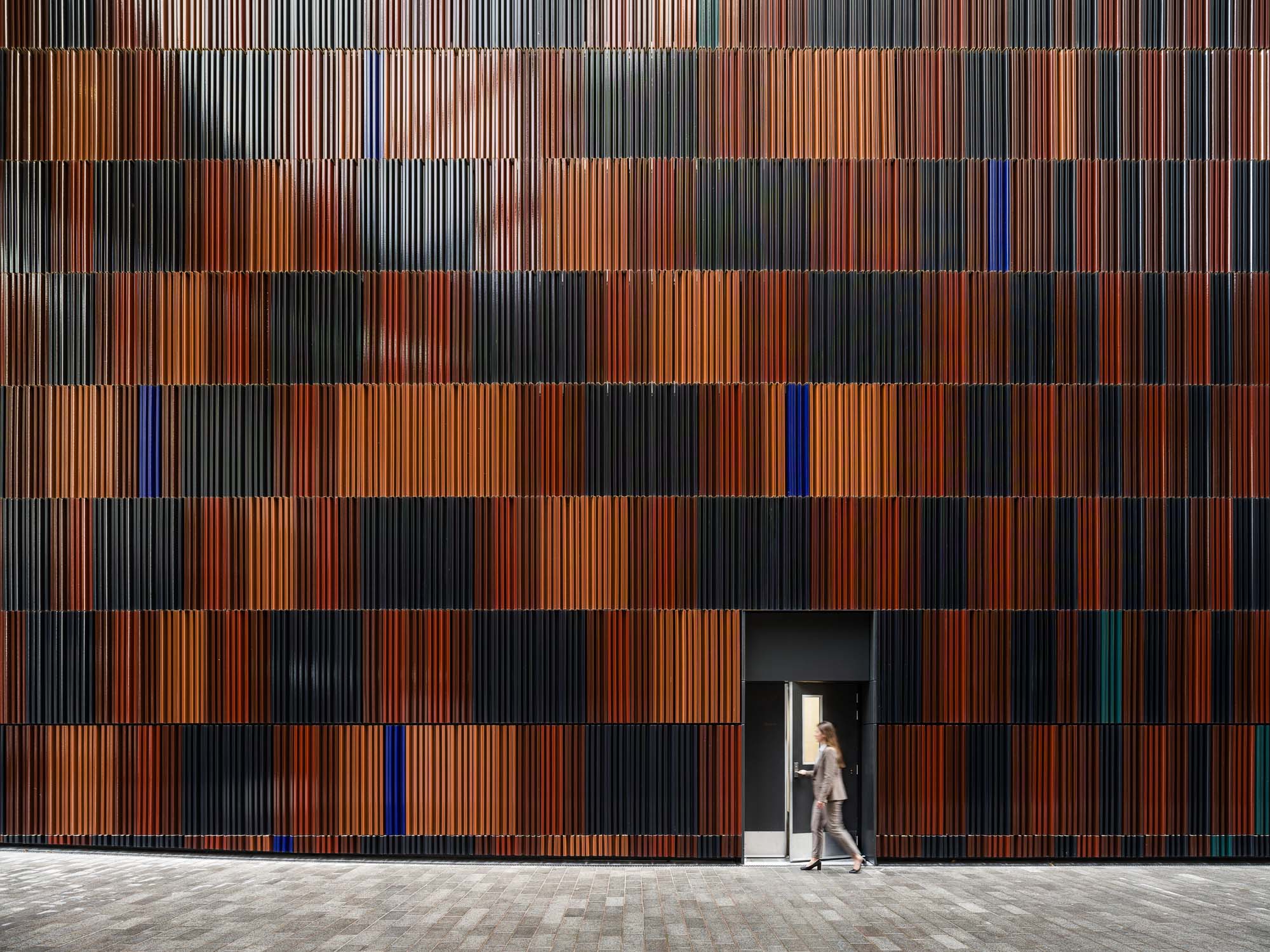 Building facade with colourful vertical ceramic tiles